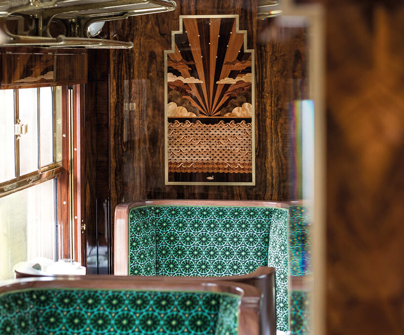 wes anderson revives 1950s train carriage inviting visitors into whimsical film sets
