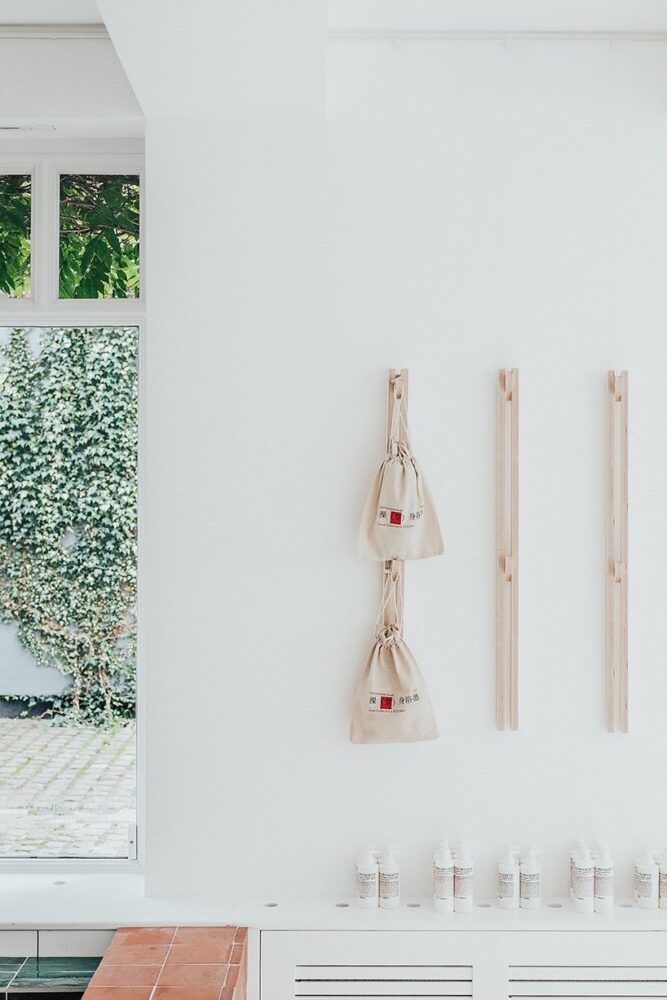 shoe rack and malin+goetz skincare products