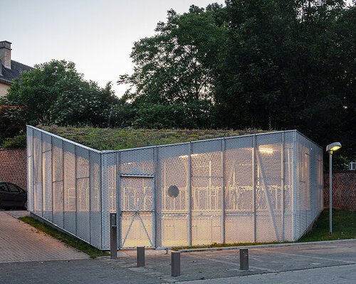 WAW architects builds permeable bicycle pavilion in belgium wrapped in a mesh metal box