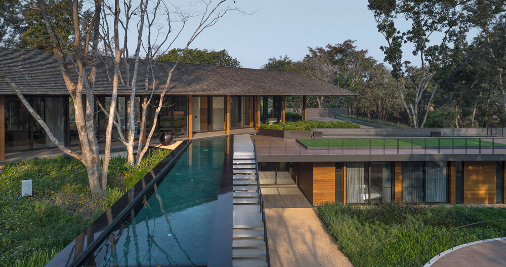architects 49 integrates its diagonal house into the forested landscape architects 49 integrates its diagonal house into the forested landscape