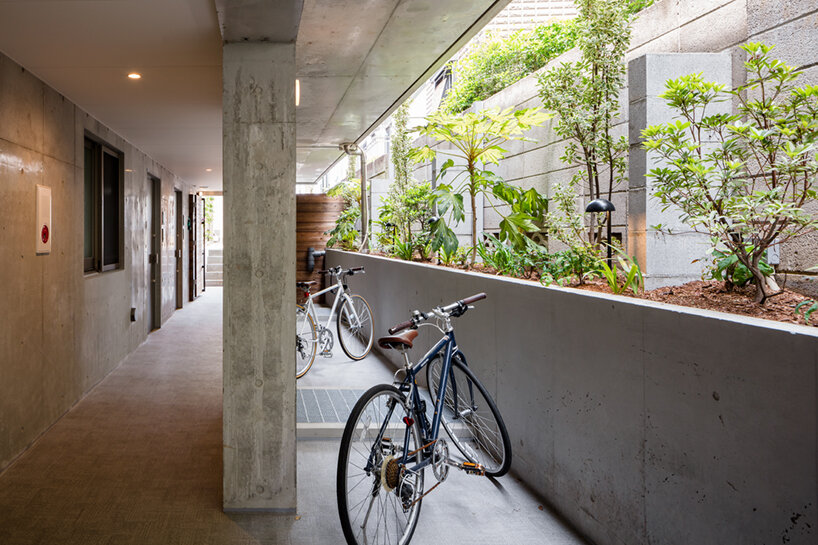 furuya design’s hanegi + housing is an array of angled, floating volumes in tokyo