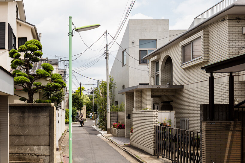 furuya design’s hanegi + housing is an array of angled, floating volumes in tokyo