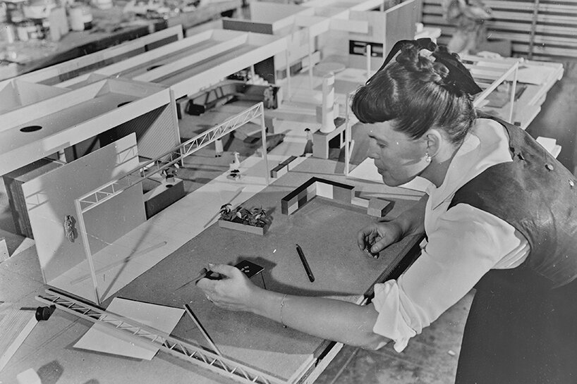 ray eames working on a model, 1950, © eames office LLC