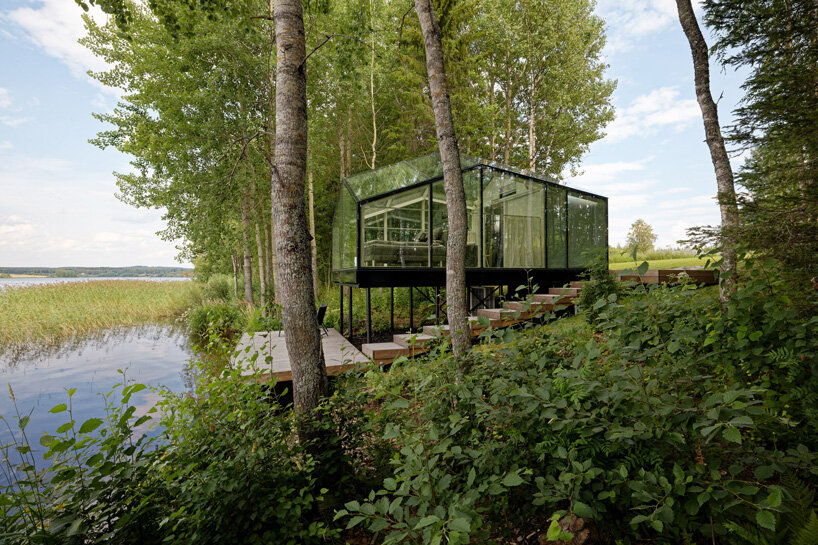 mirrored glass cabin by pirinen & salo disappears into finland's rich natural landscape