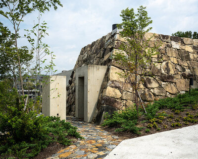 tomoaki uno references an aztec pyramid for introverted stone house in japan