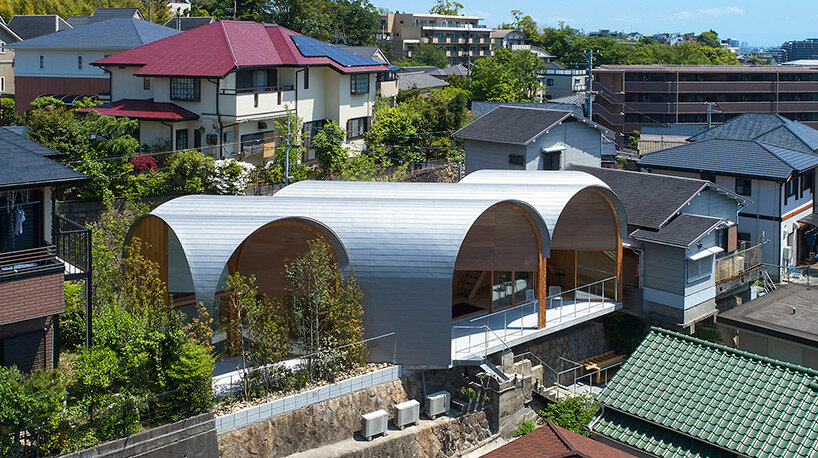 a series of tilted vaulted roofs tops wooden house by tomohiro hata in koyoen, japan