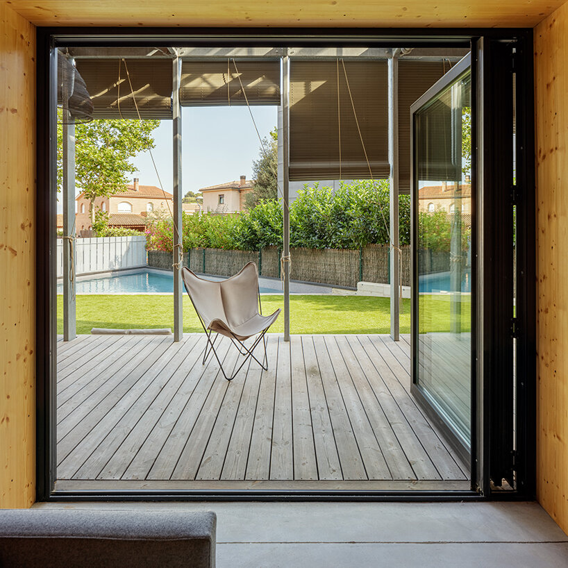 outside barcelona, SUMO architects wraps its BE house in an operable shading system - 1
