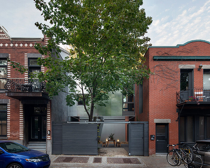 T B A bridges century-old carriage home with a floating extension in montréal