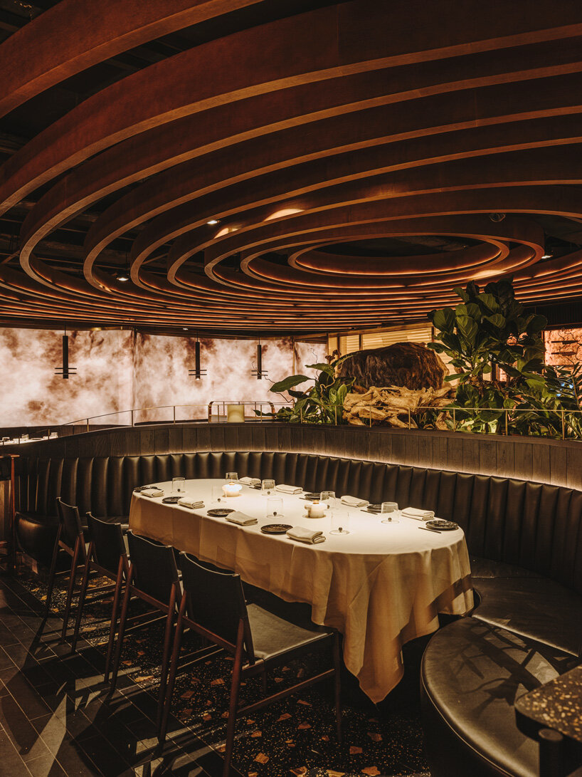 sculptural wooden ceiling tops astet studio's leña marbella restaurant in spain