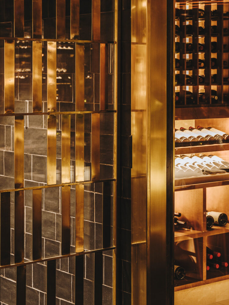 the black steel and brass wine cellar houses the restaurant's collection of more than 1,000 bottles