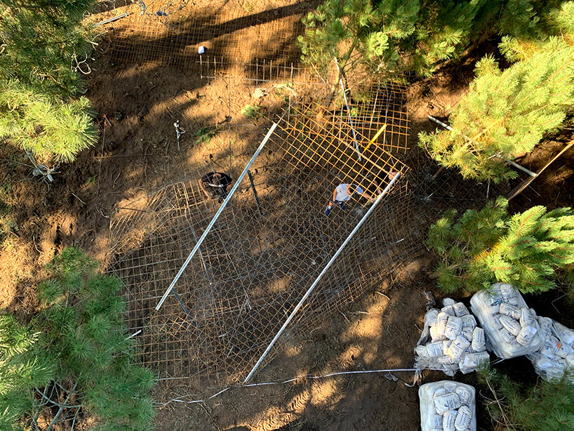 ensamble studio shapes the tent as a blanket that covers the space in spain