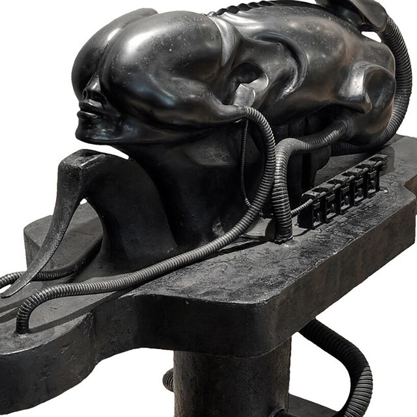 biomechanoid (1969) sculpture - part-industrial beings are trapped in positions within an incubator-like apparatus