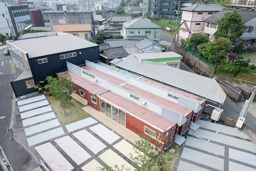second-hand red shipping containers form 'kotobuki' cheese factory by micelle in japan