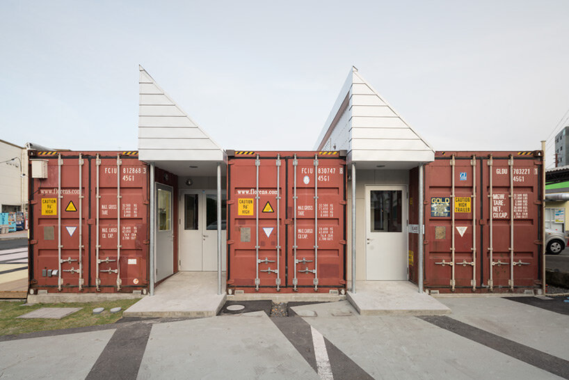 second-hand red shipping containers form 'kotobuki' cheese factory by micelle in japan