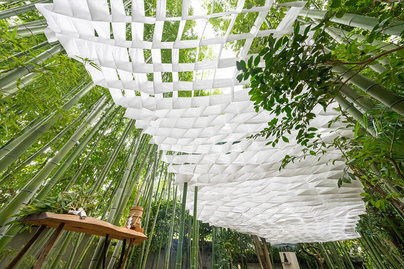 kengo kuma's interwoven pavilion hovers among bamboo grove in tokyo