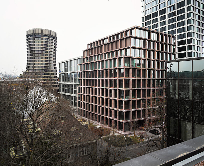 reocurring house-shaped elements articulate concrete office tower by valerio olgiati in switzerland