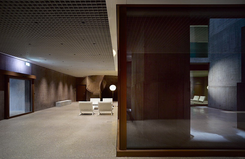 reocurring house-shaped elements articulate concrete office tower by valerio olgiati in switzerland