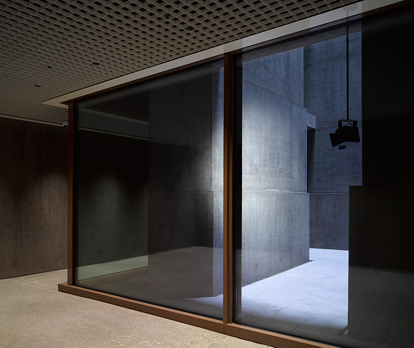 reocurring house-shaped elements articulate concrete office tower by valerio olgiati in switzerland