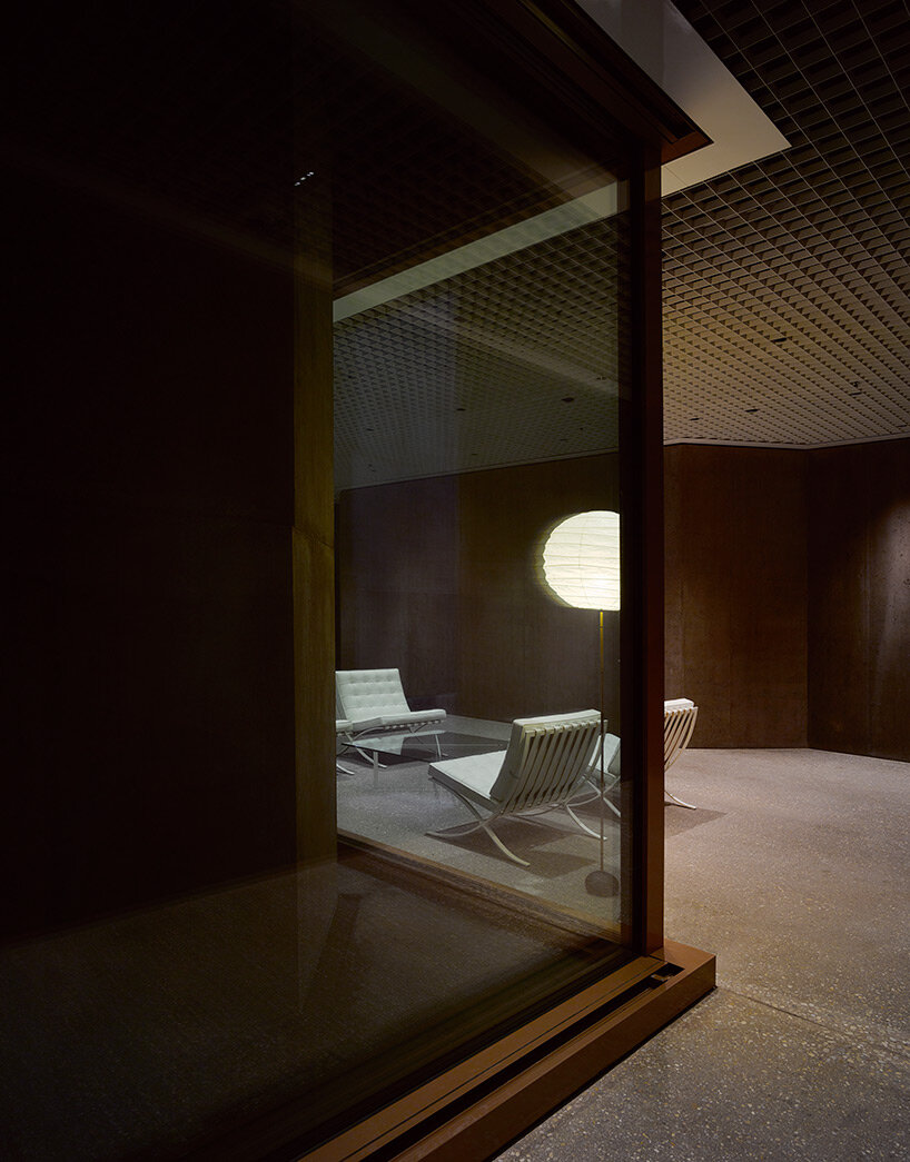 reocurring house-shaped elements articulate concrete office tower by valerio olgiati in switzerland