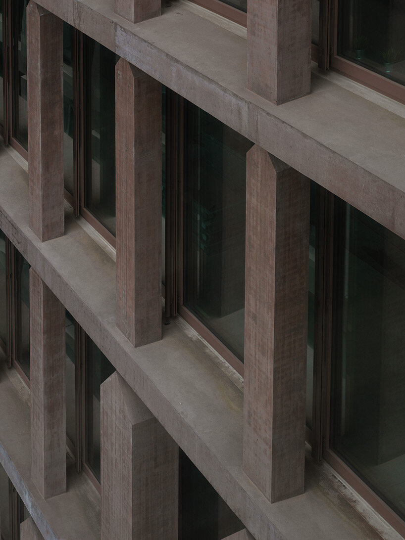 reocurring house-shaped elements articulate concrete office tower by valerio olgiati in switzerland