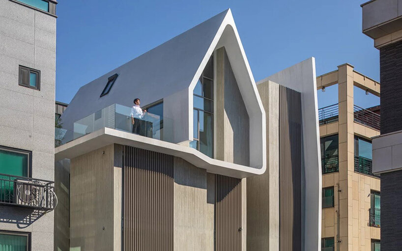 house-shaped volume in korea by rieuldorang atelier marks 'with home' corporate identity