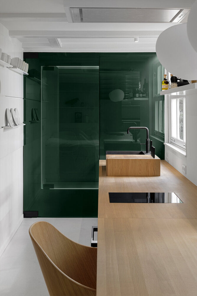 the dark green surfaces reveal another space 