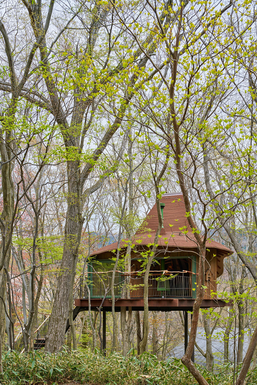 this treehouse by hiroshi nakamura & NAP architects seeks the richness of a frugal life
