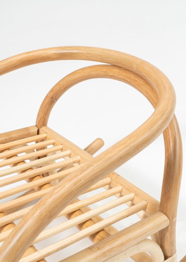 the small rocking chair design draws from the lines of traditional chinese folk furniture