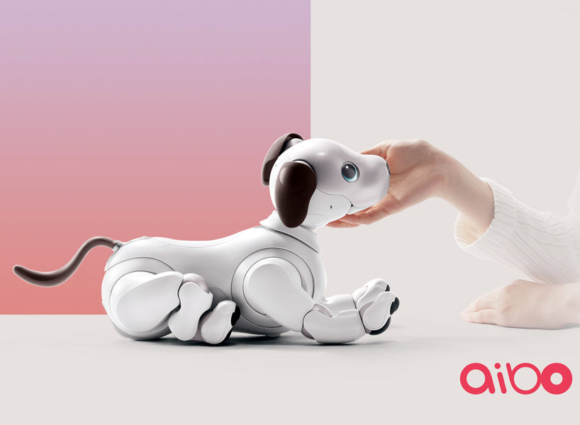 sony’s puppy robot can now be carried with its new sling that resembles a baby carrier