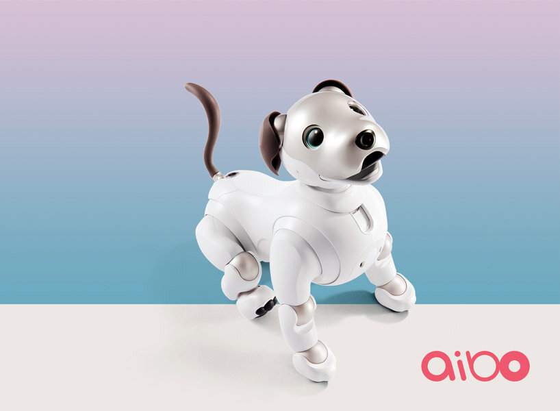 sony’s puppy robot can now be carried with its new sling that resembles a baby carrier