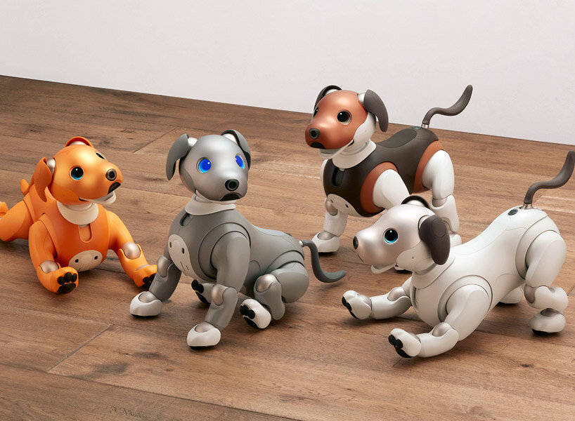 sony’s puppy robot can now be carried with its new sling that resembles a baby carrier