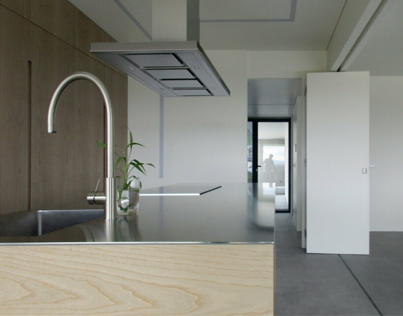  UTOPIA’s concrete house gently digs into its greenery terrain in portugal