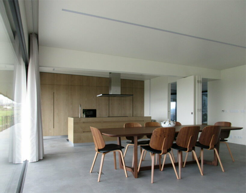  UTOPIA’s concrete house gently digs into its greenery terrain in portugal