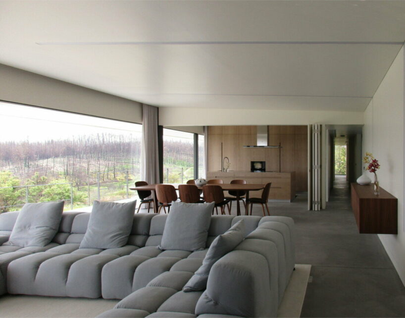  UTOPIA’s concrete house gently digs into its greenery terrain in portugal