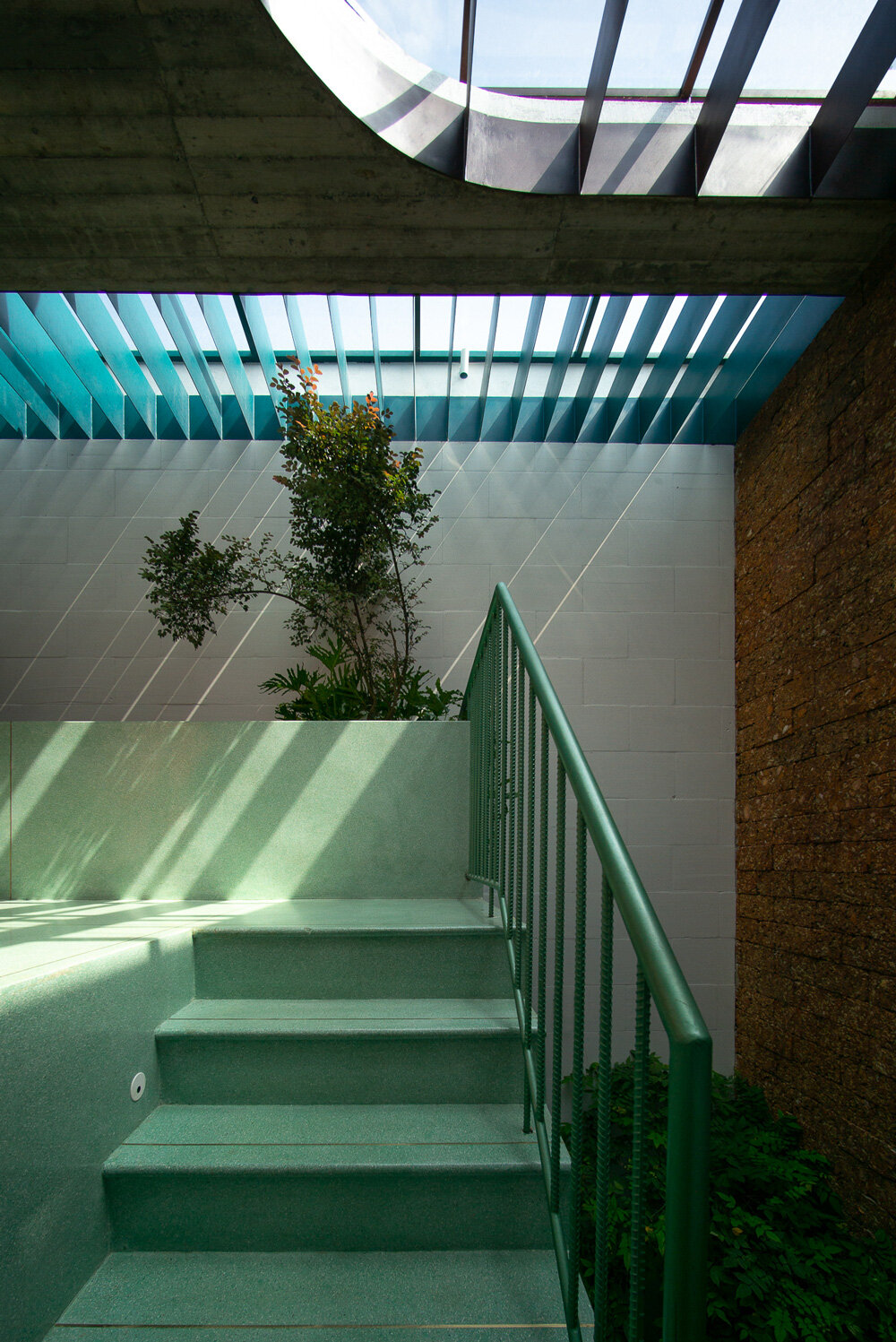 wooden revolving shutters clad the facade of AD9 architects' H house in ...