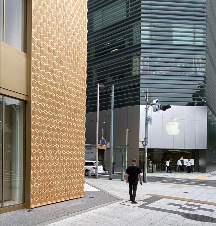 klein dytham architecture clads osaka's cartier store façade in geometric wooden pattern  