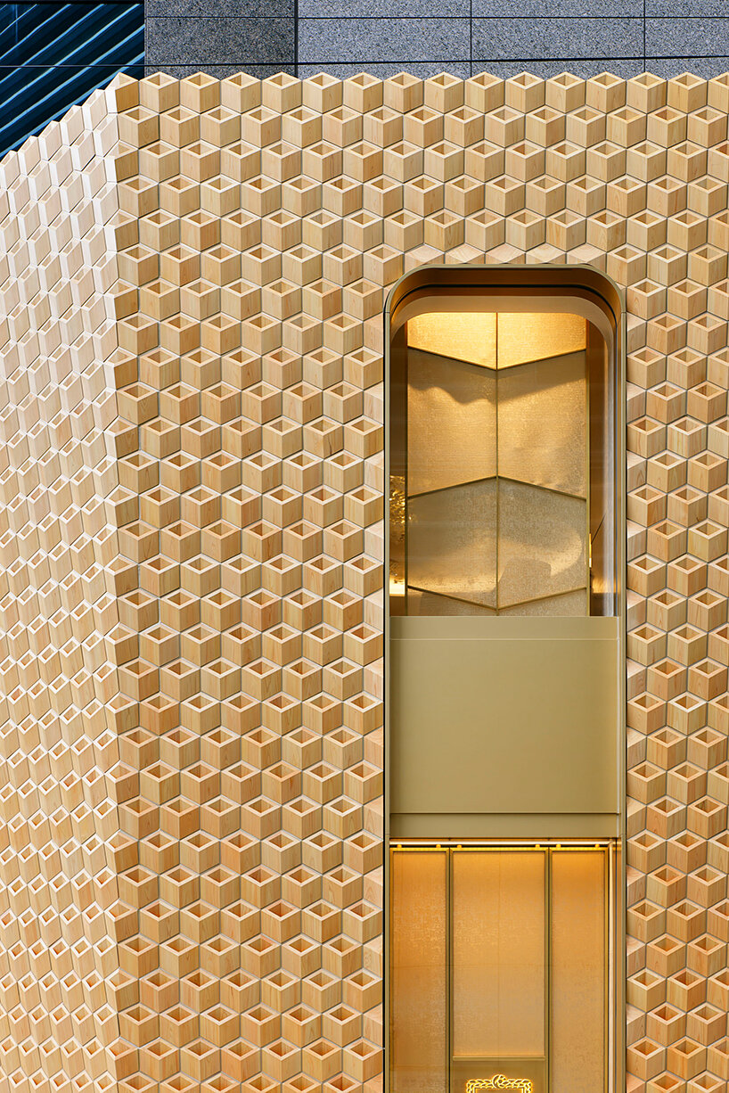klein dytham architecture clads osaka's cartier store façade in geometric wooden pattern  