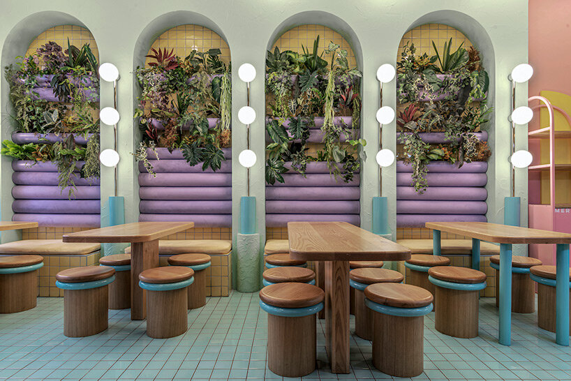 masquespacio infuses restaurant interior in france with pastel tones and lush greenery