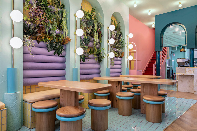masquespacio infuses restaurant interior in france with pastel tones and lush greenery