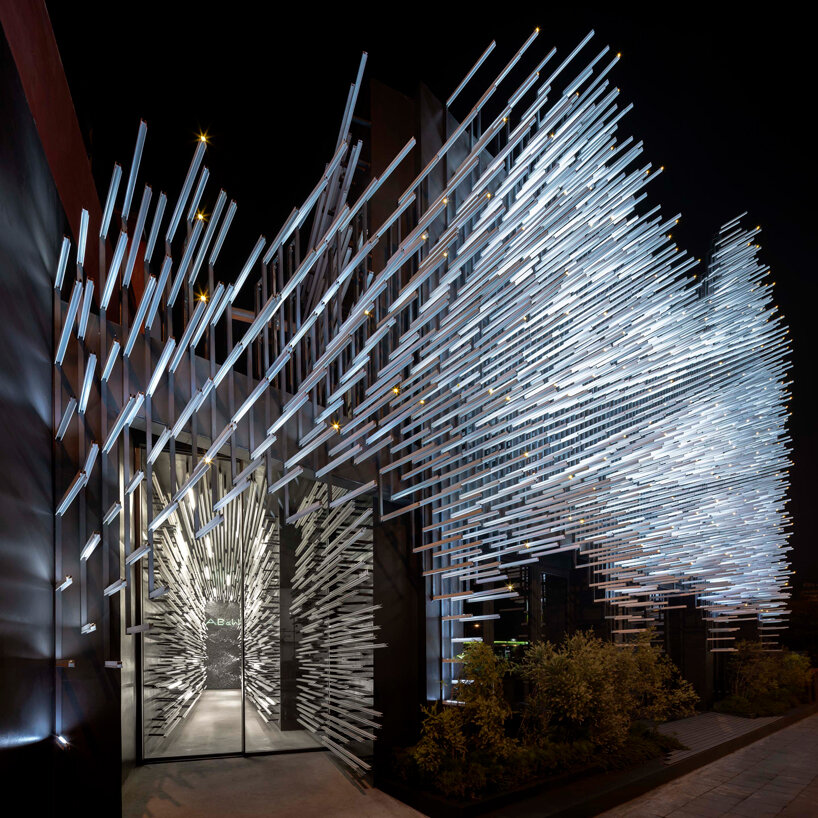 layered aluminum strips evoke dandelion seeds for this museum façade in bangkok - 3