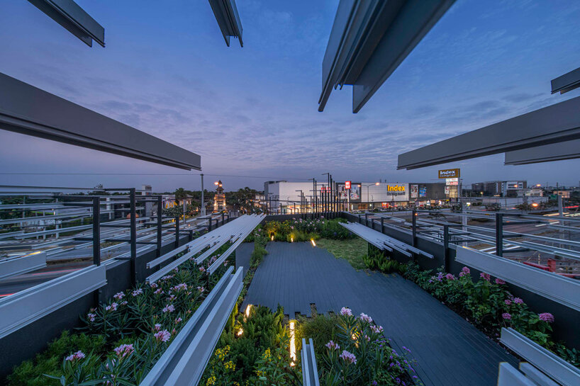 layered aluminum strips evoke dandelion seeds for this museum façade in bangkok - 6
