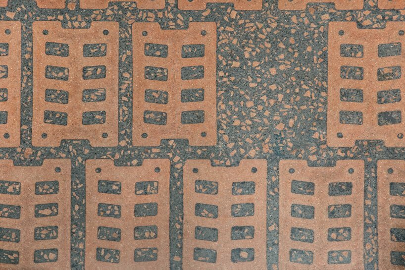flooring made with customized brick holding BCB’s brand identity