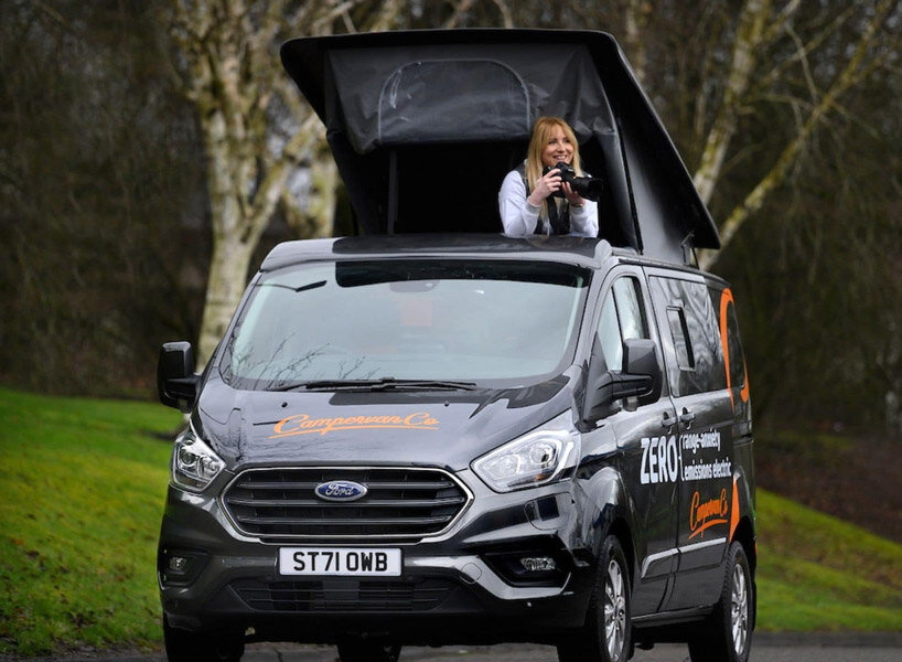 solar panels charge the new and spacious ford camper, making it fully electric