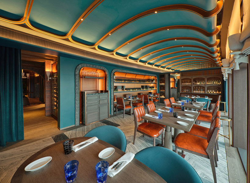 sky-high ‘the cellar’ by andré fu studio seats 28 diners and holds 400 premium wine labels