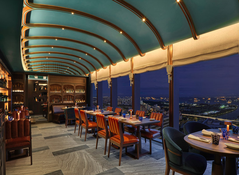 sky-high ‘the cellar’ by andré fu studio seats 28 diners and holds 400 premium wine labels