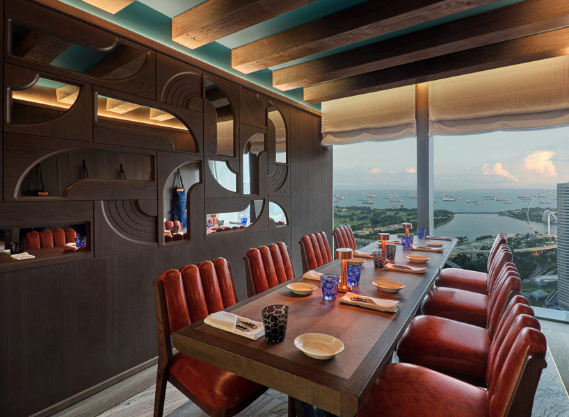 sky-high ‘the cellar’ by andré fu studio seats 28 diners and holds 400 premium wine labels