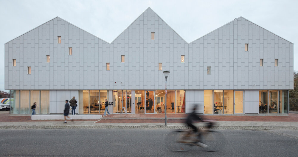 christensen & co. tops viby library with minimalist row of danish rooftops