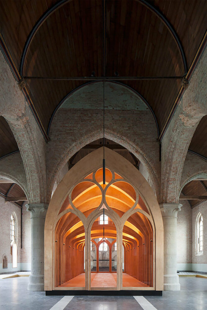 dhooge & meganck installs wooden ‘house of silence’ within renovated church in belgium