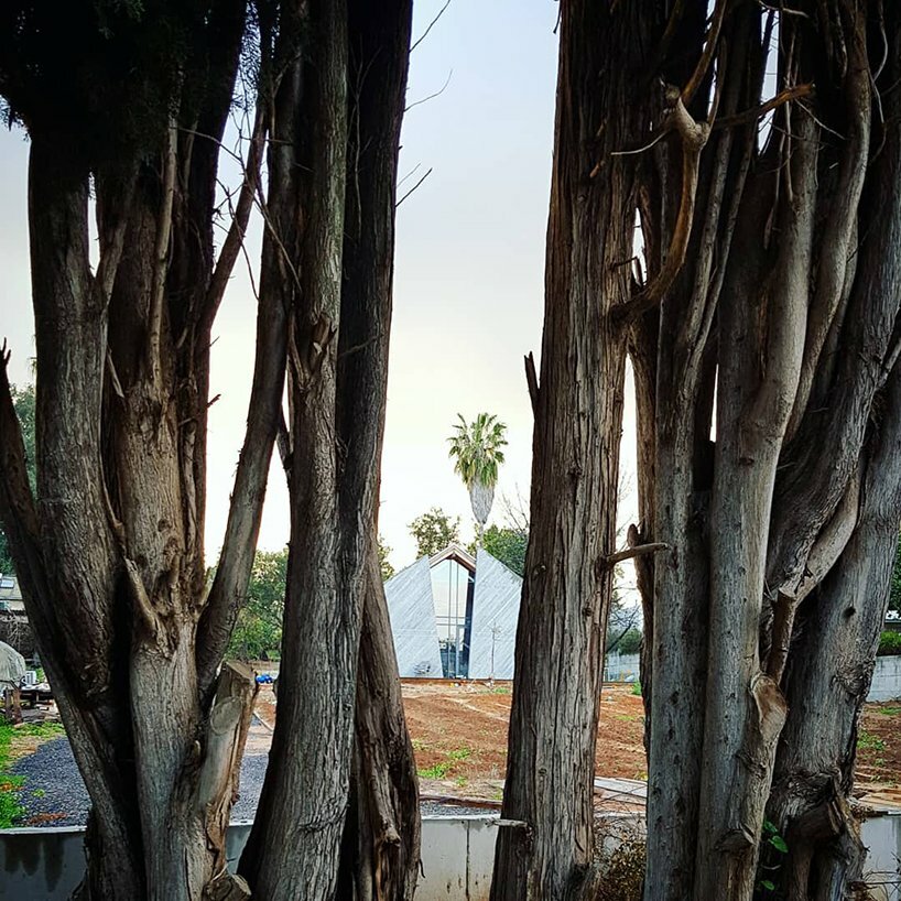 the front facade, looking from the end of the lot