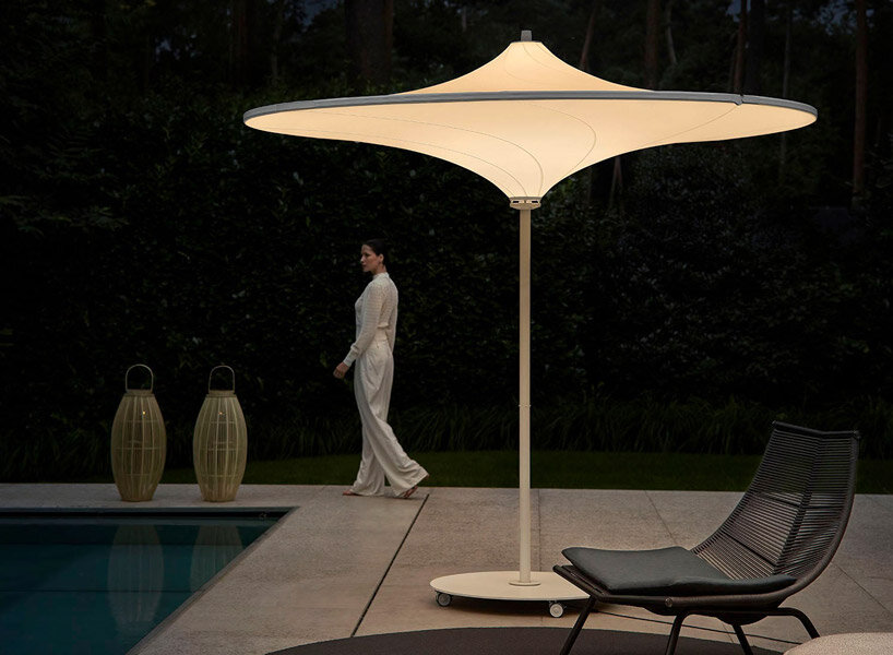 belgium-designed hulasol is a sun umbrella by day and an outdoor lamp by night